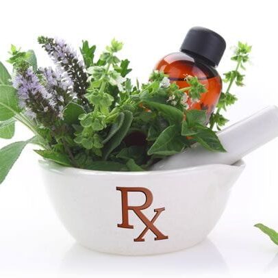 A mortar with herbs and an rx bottle in it.